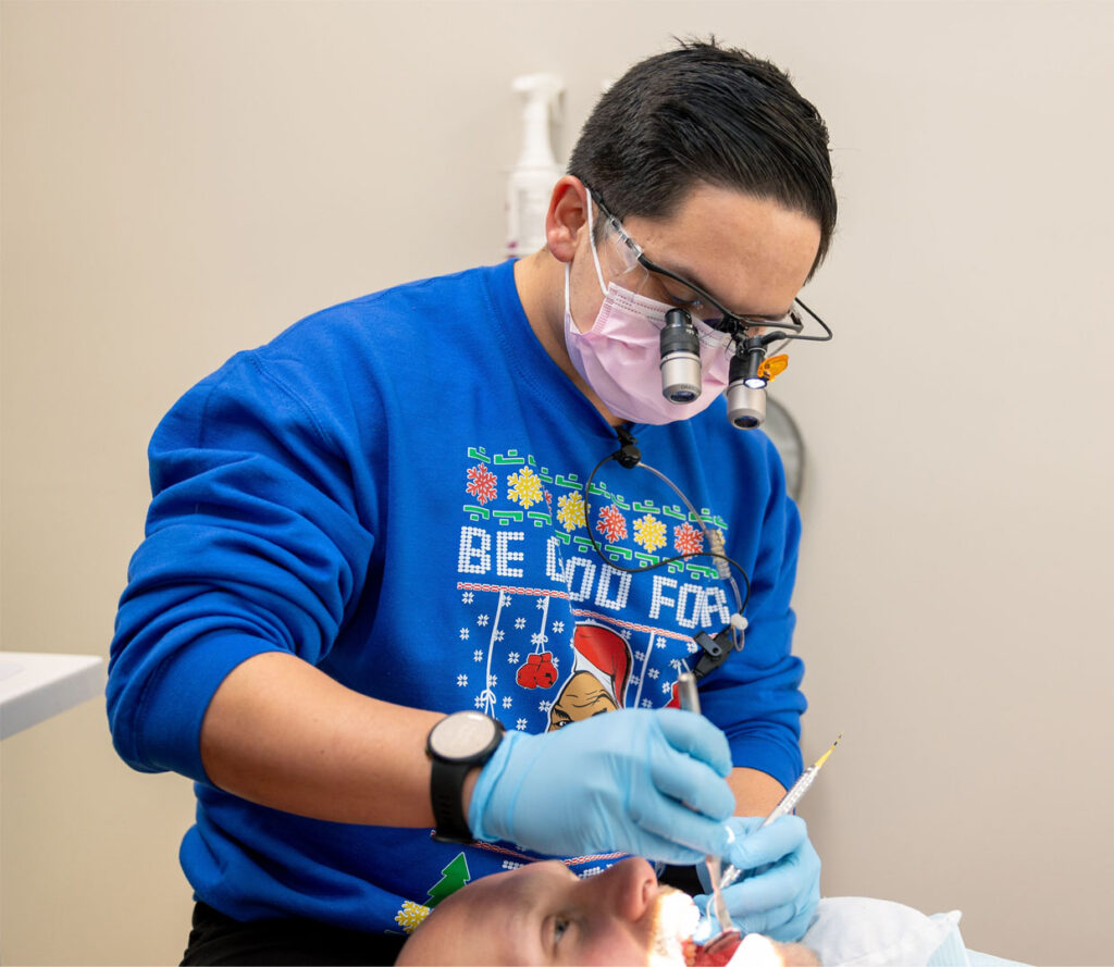 Dr. Page examining a patient's teeth