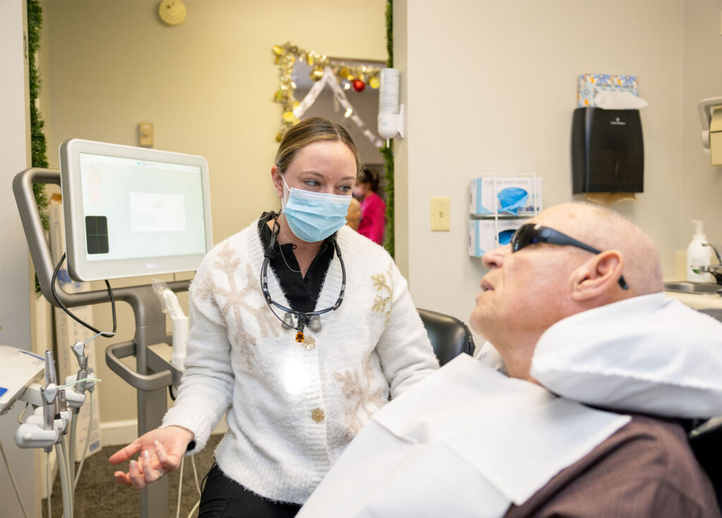 Dr. Pilling talking with a patient