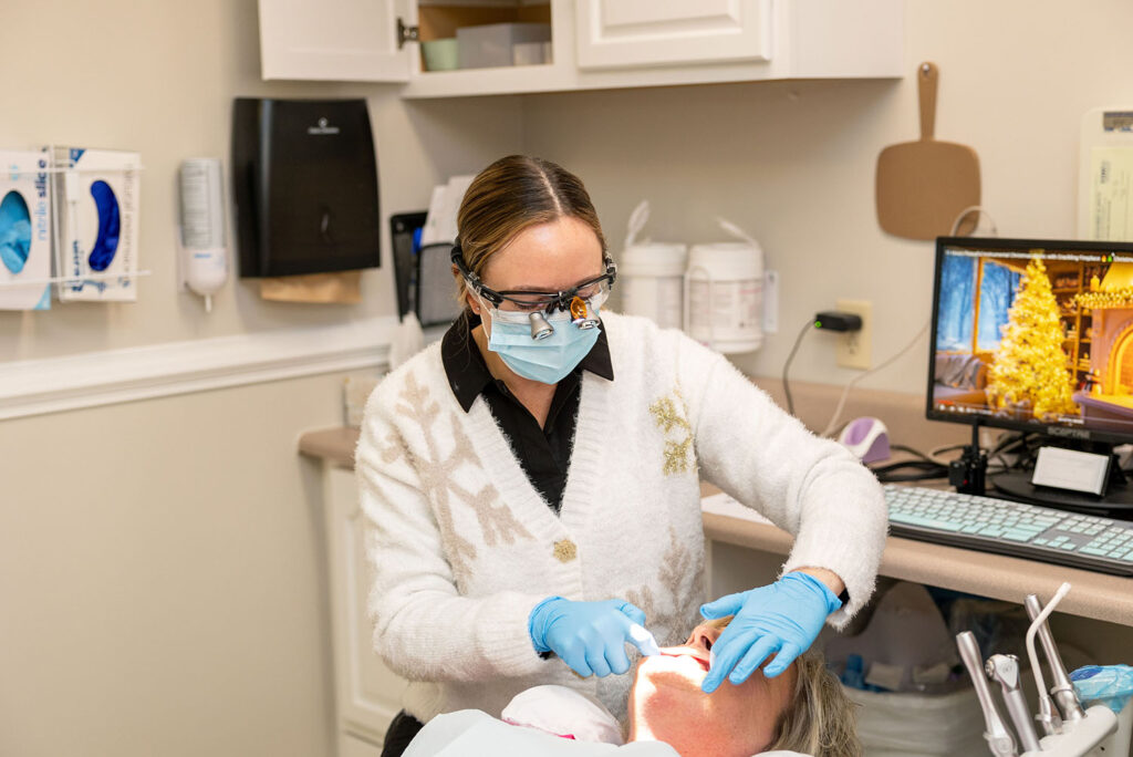 Dr. Pilling checking a patient's teeth