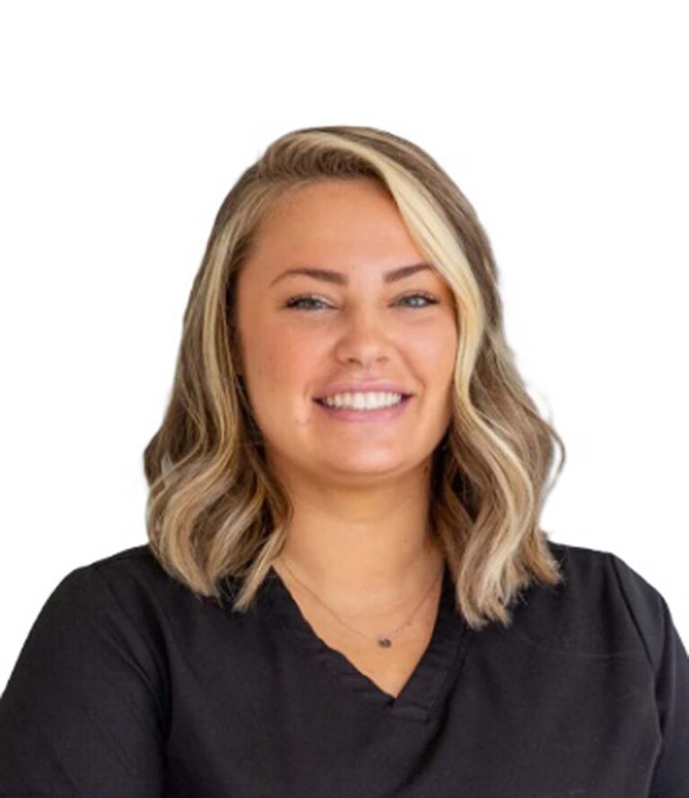 Headshot of Lauren, insurance coordinator at Dinwiddie Dental. She is wearing a black scrubs and necklace in a plain white background.